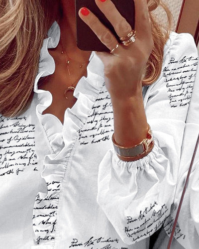 Shirley – Langärmlige Rüschenbluse