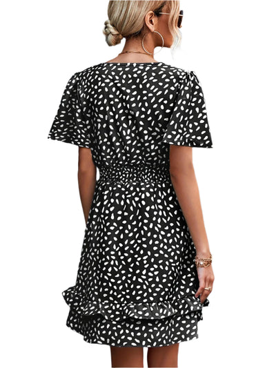 Tara - gepunktetes Print und elegantes Kleid mit Rüschensäumen